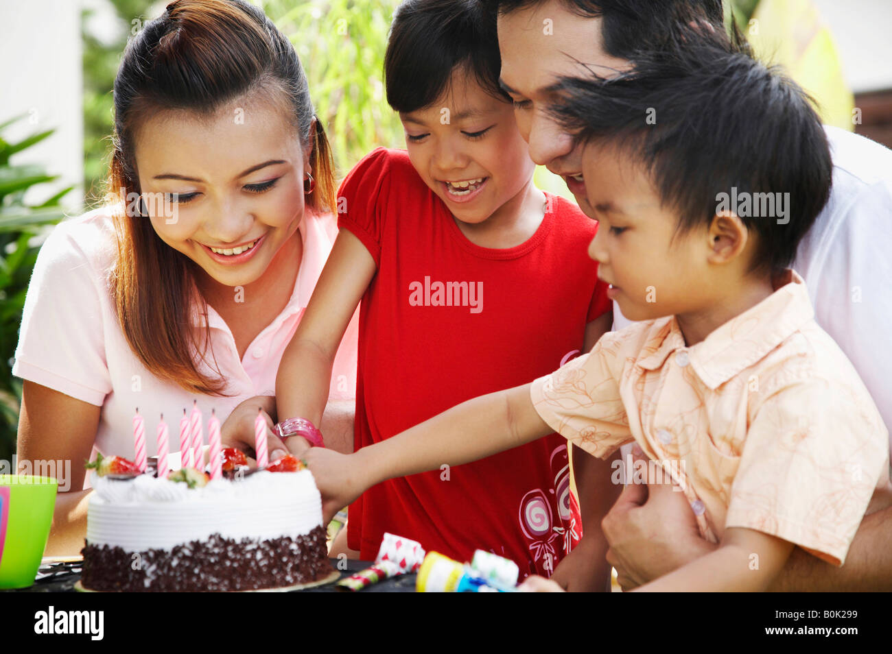 Cutting birthday cake Stock Photo Alamy