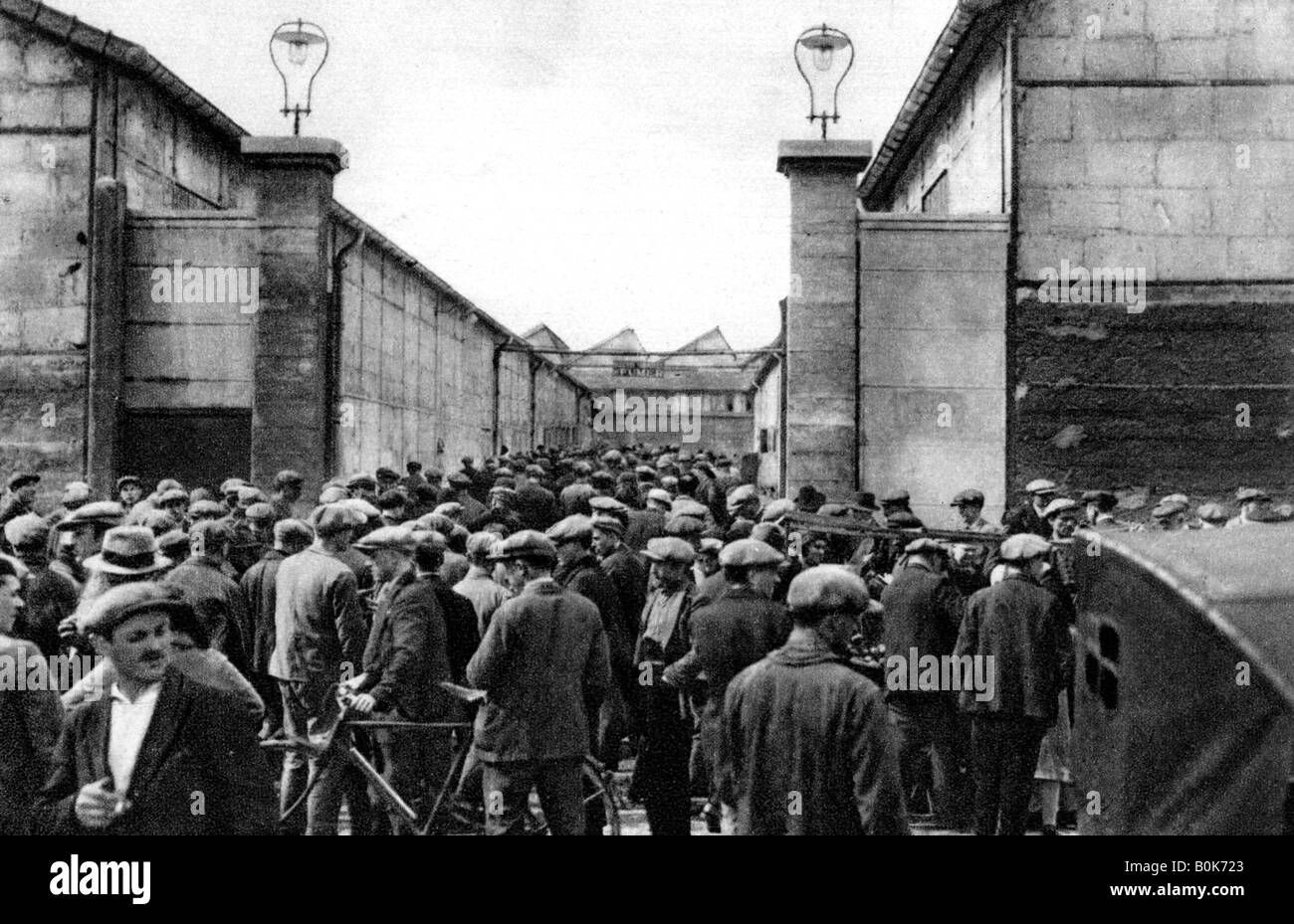 Workers at the entrance of a Billancourt factory, Paris, 1931.Artist: Ernest Flammarion Stock Photo