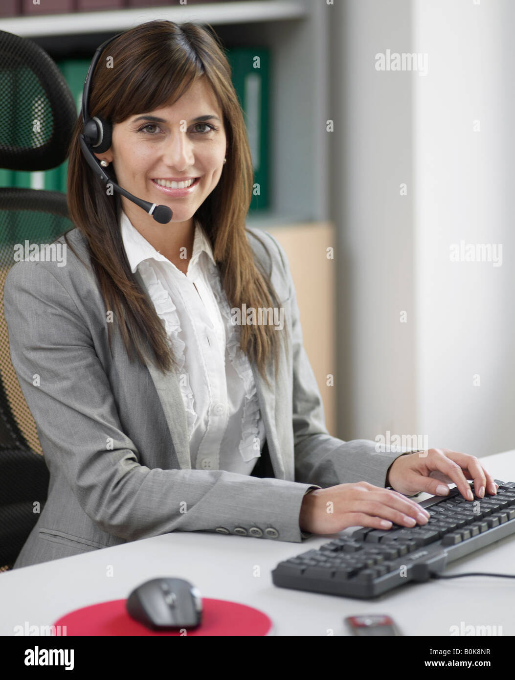 Telephone Operator at Desk Stock Photo