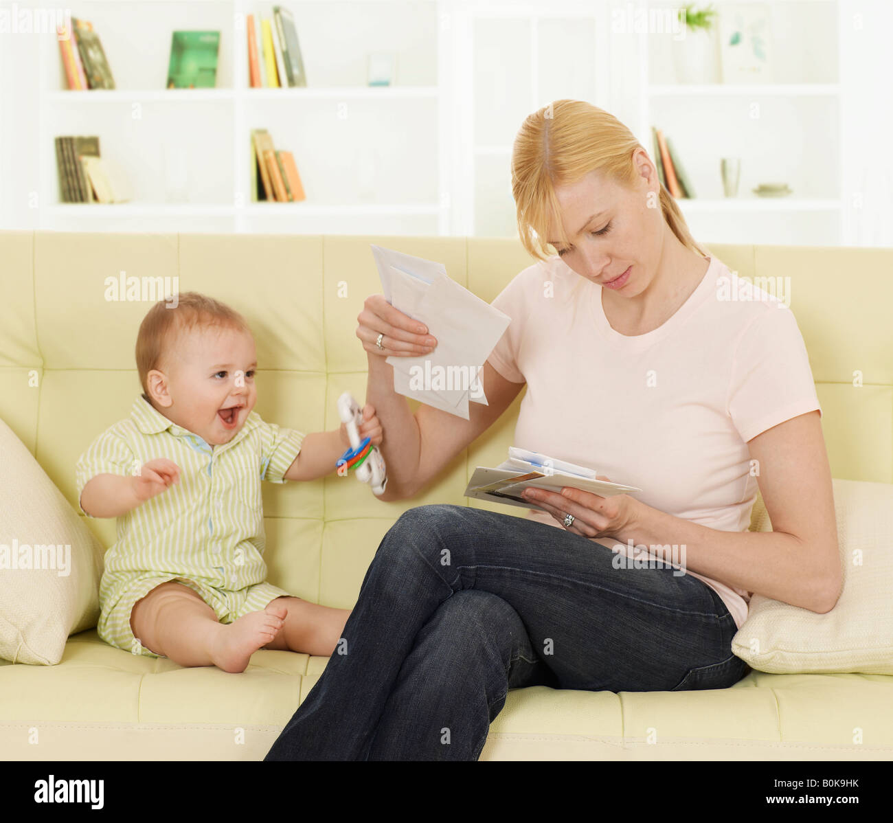 Mother with Baby Boy Checking Mail Stock Photo