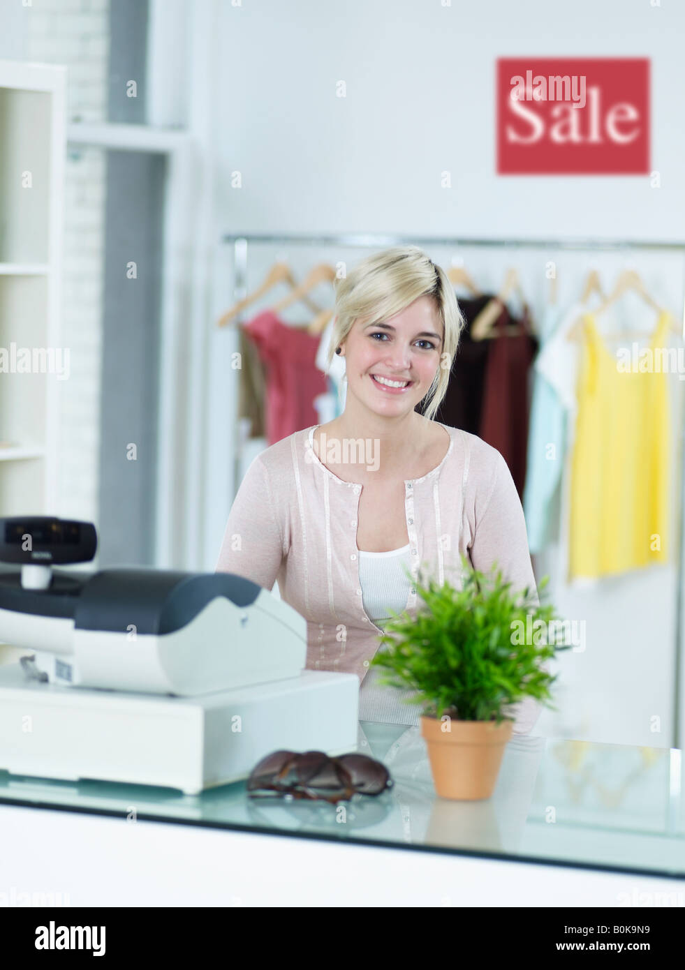 Sales Clerk in Clothes Store Stock Photo Alamy