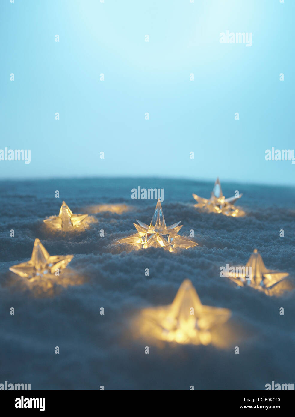 Illuminated Stars in Snow Stock Photo