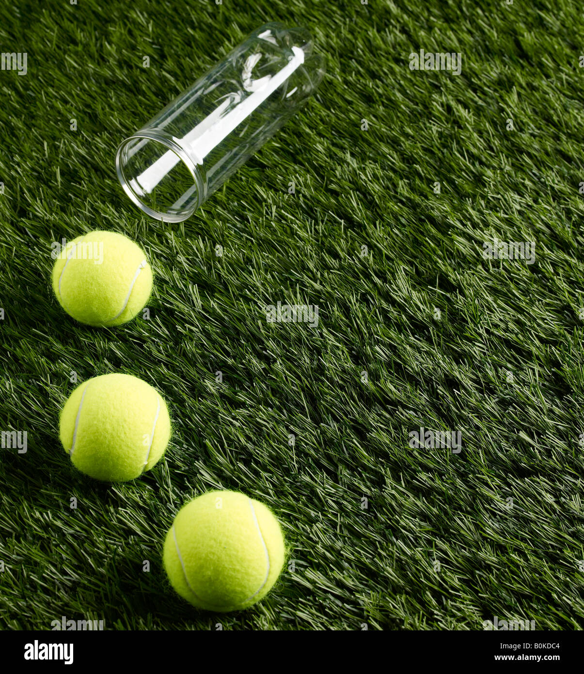 Three Tennis Balls on Grass Stock Photo Alamy