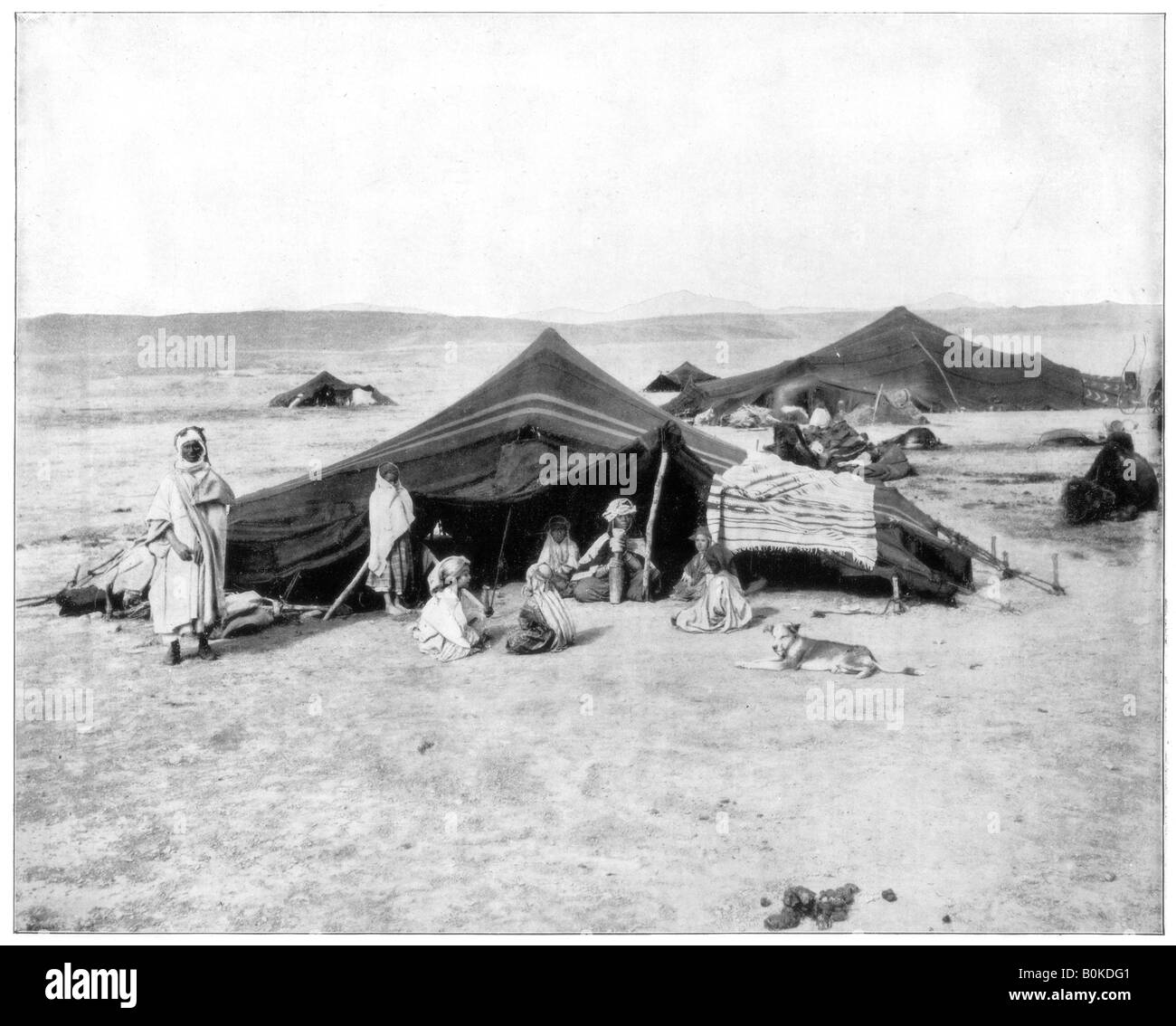 Caravan camp, Sahara Desert, late 19th century. Artist: John L Stoddard Stock Photo