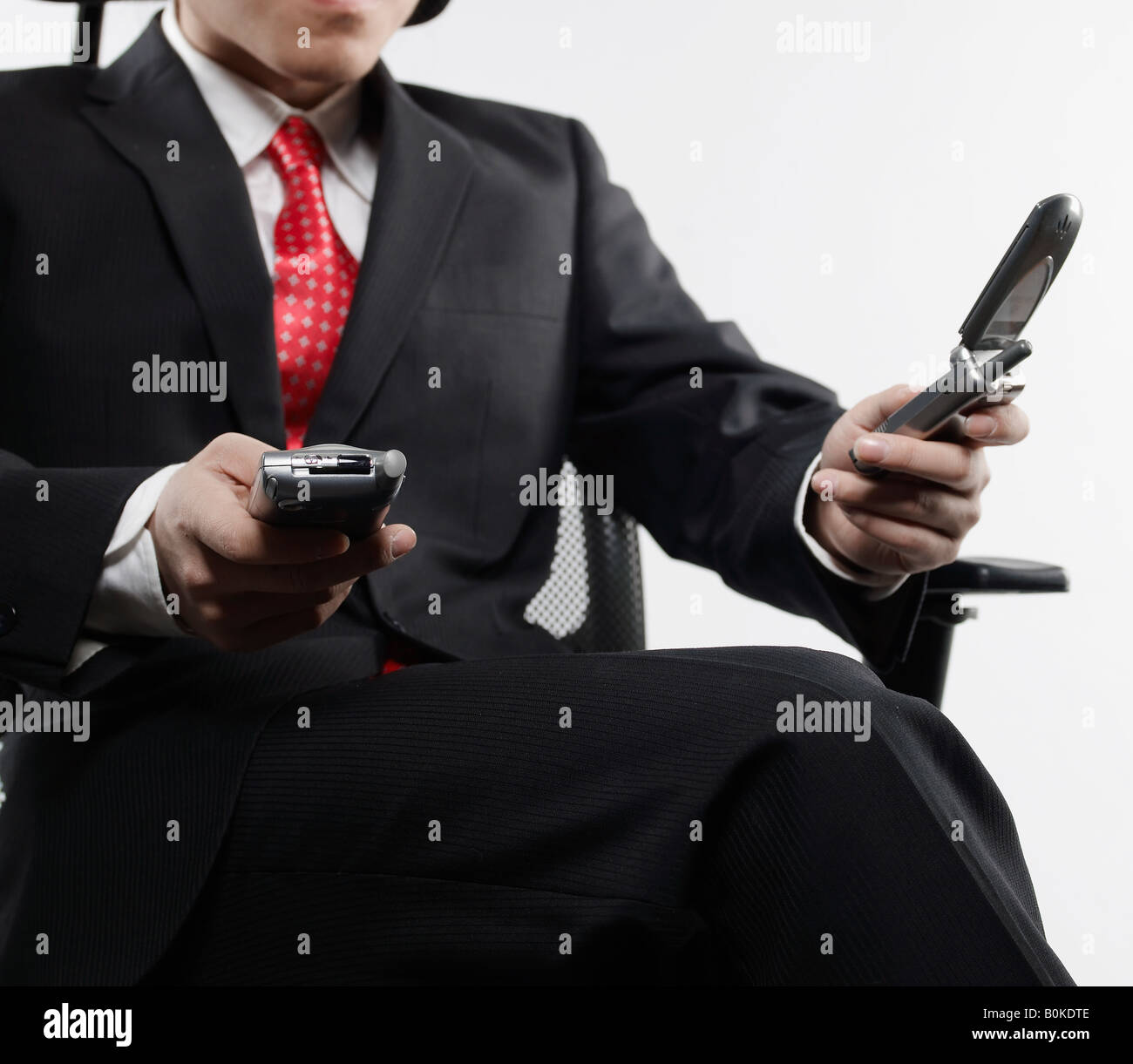 Businessman Using PDA and Mobile Phone Stock Photo Alamy