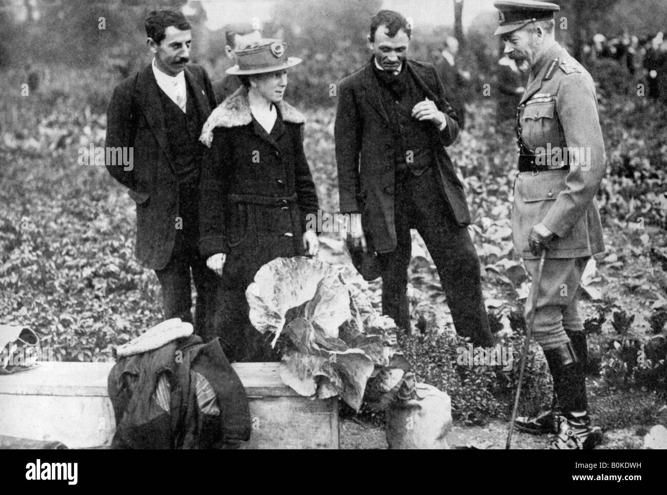 King George V admiring allotments on Clapham Common, London, c1910s-c1920s (1936). Artist: Unknown Stock Photo