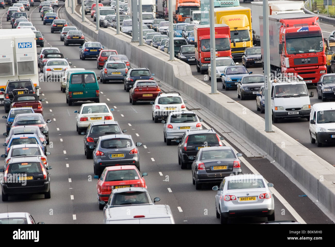Traffic congestion of cars and lorries travelling in both directions on M25 motorway London United Kingdom Stock Photo