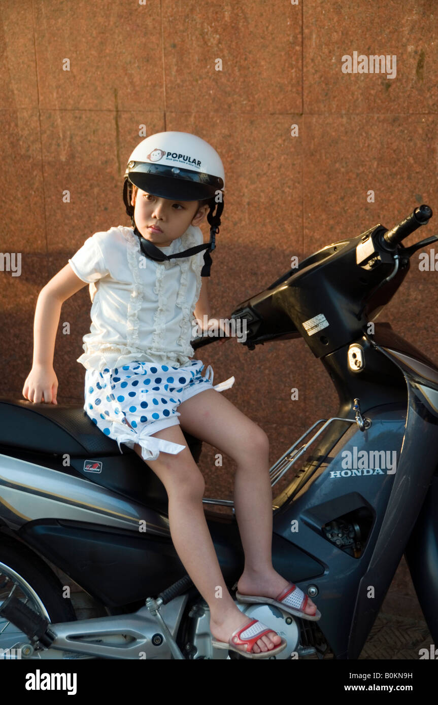 Girl on a scooter on Trang Tien, Hanoi, Vietnam Stock Photo - Alamy
