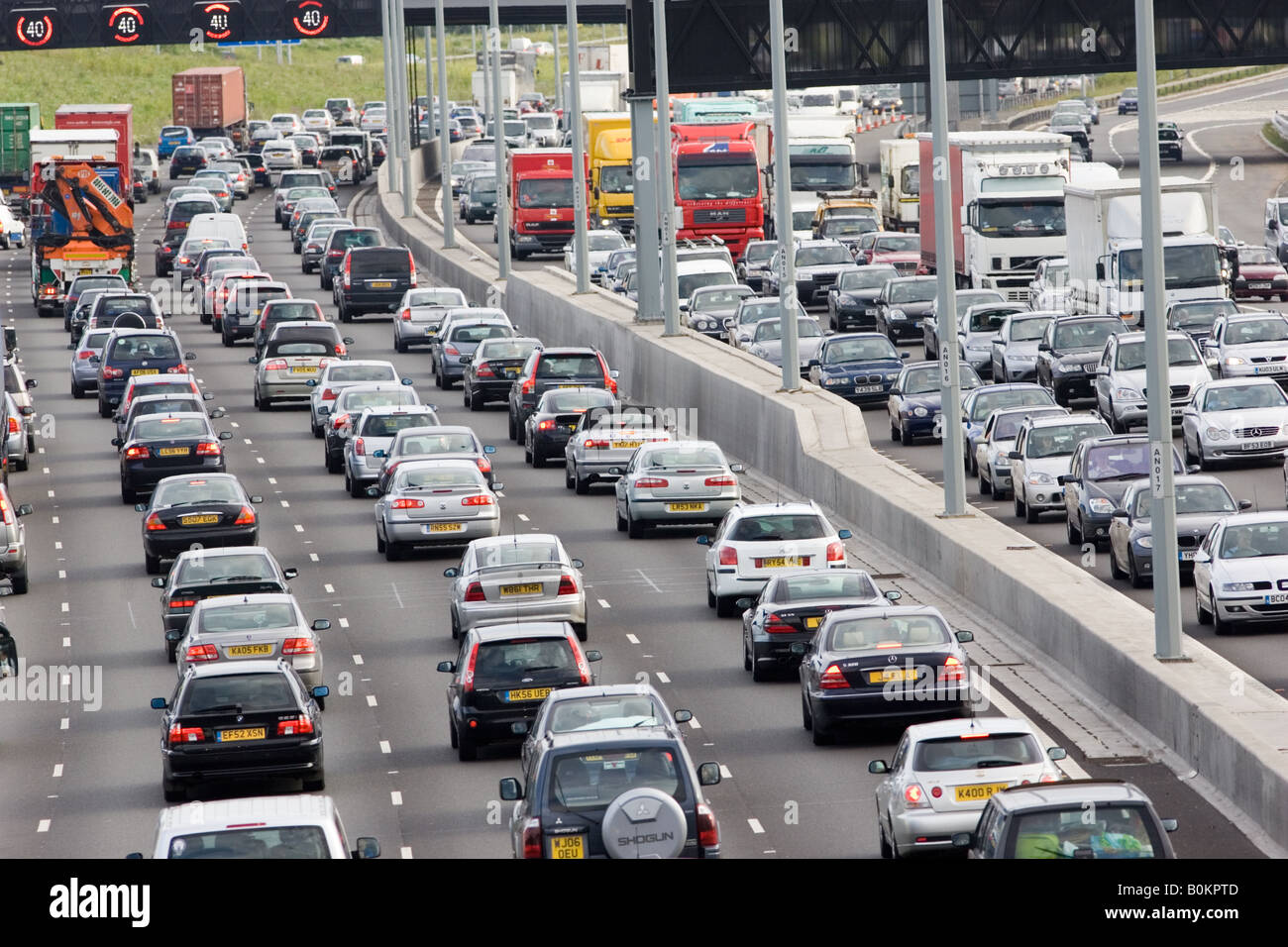 Traffic congestion of cars and lorries travelling in both directions on M25 motorway London United Kingdom Stock Photo