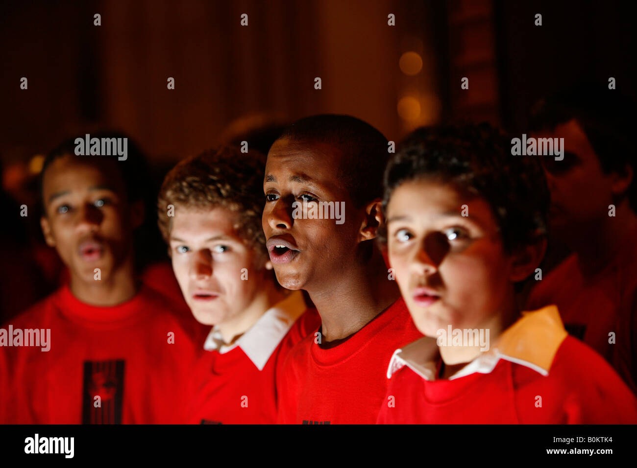 Young choir boys, keeping out of trouble by singing Stock Photo