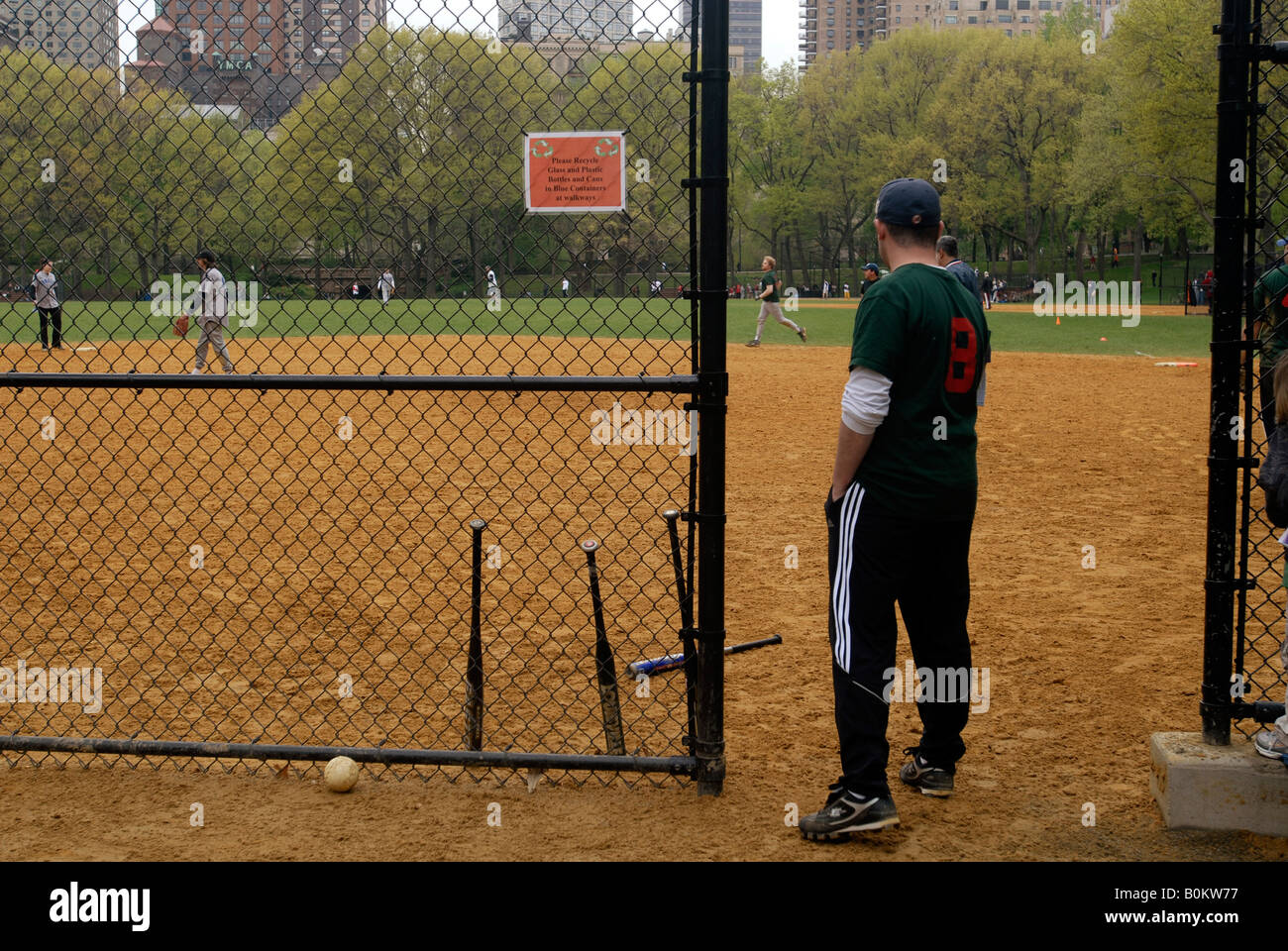 Softball leagues play on the Heckscher Fields in Central Park Stock Photo