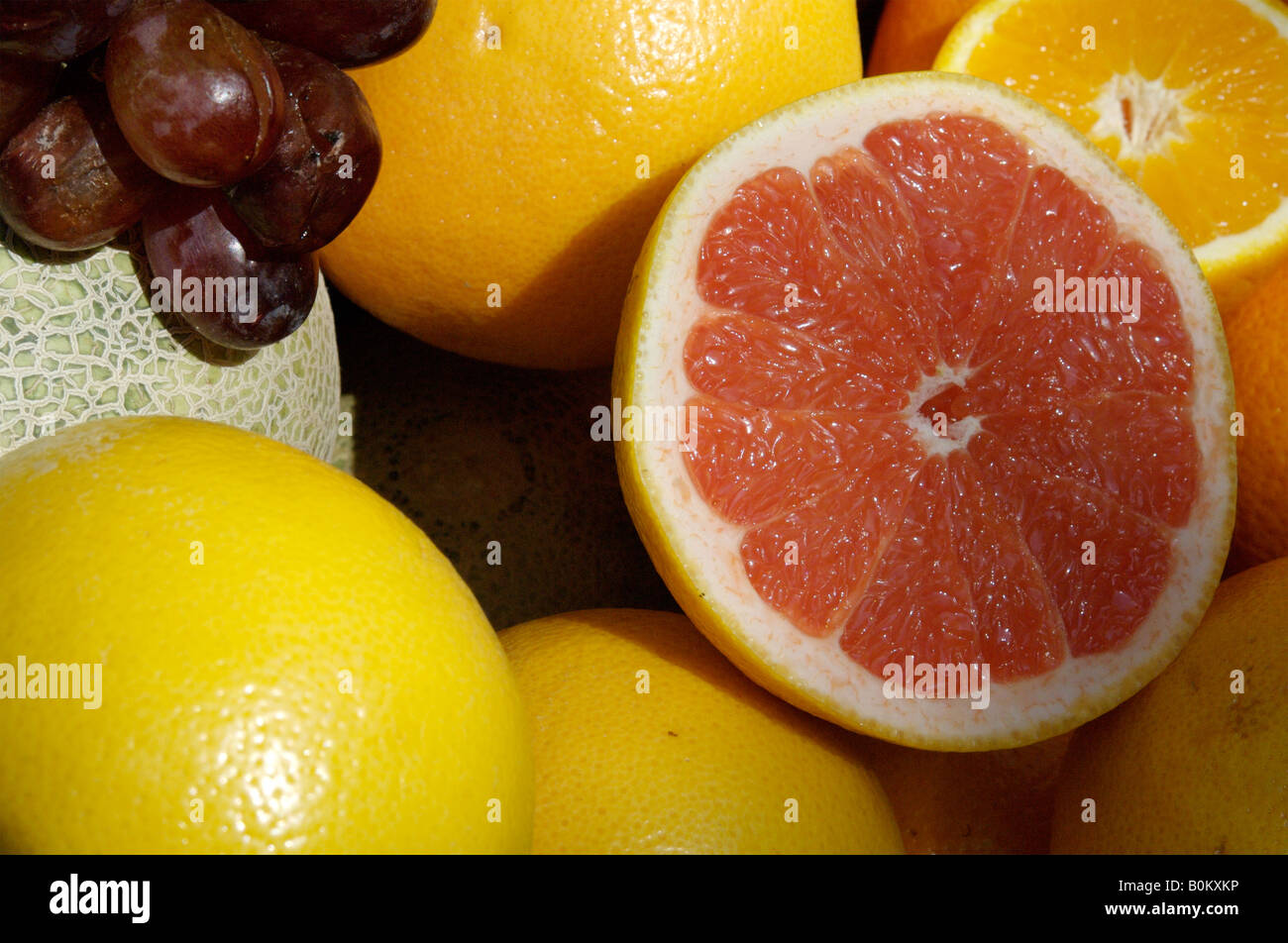 A red grapefruit cut in half Stock Photo Alamy