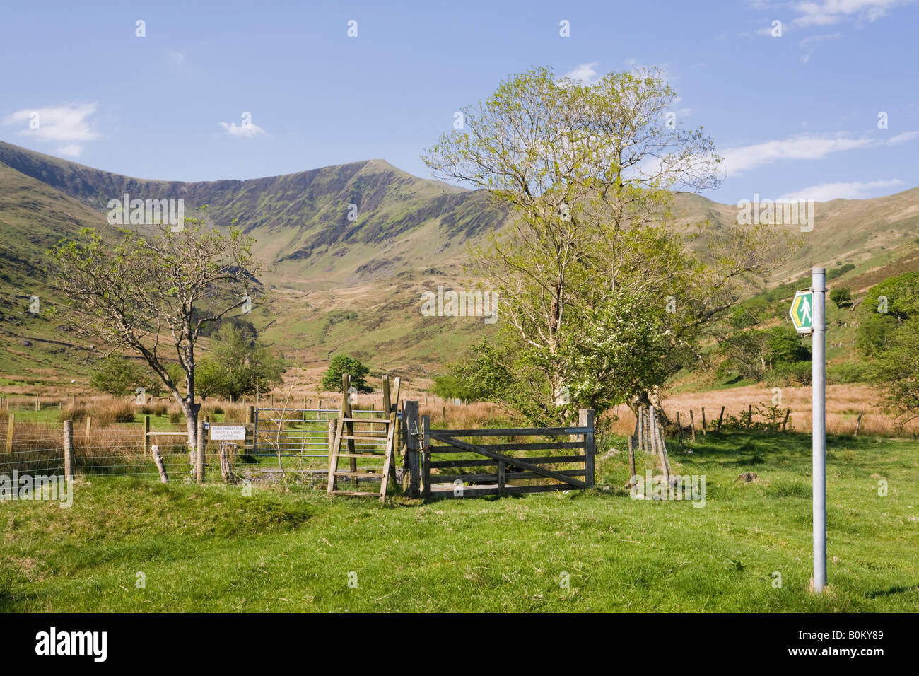 Footpath sign stile and five bar gate in Cwm Pennant valley with