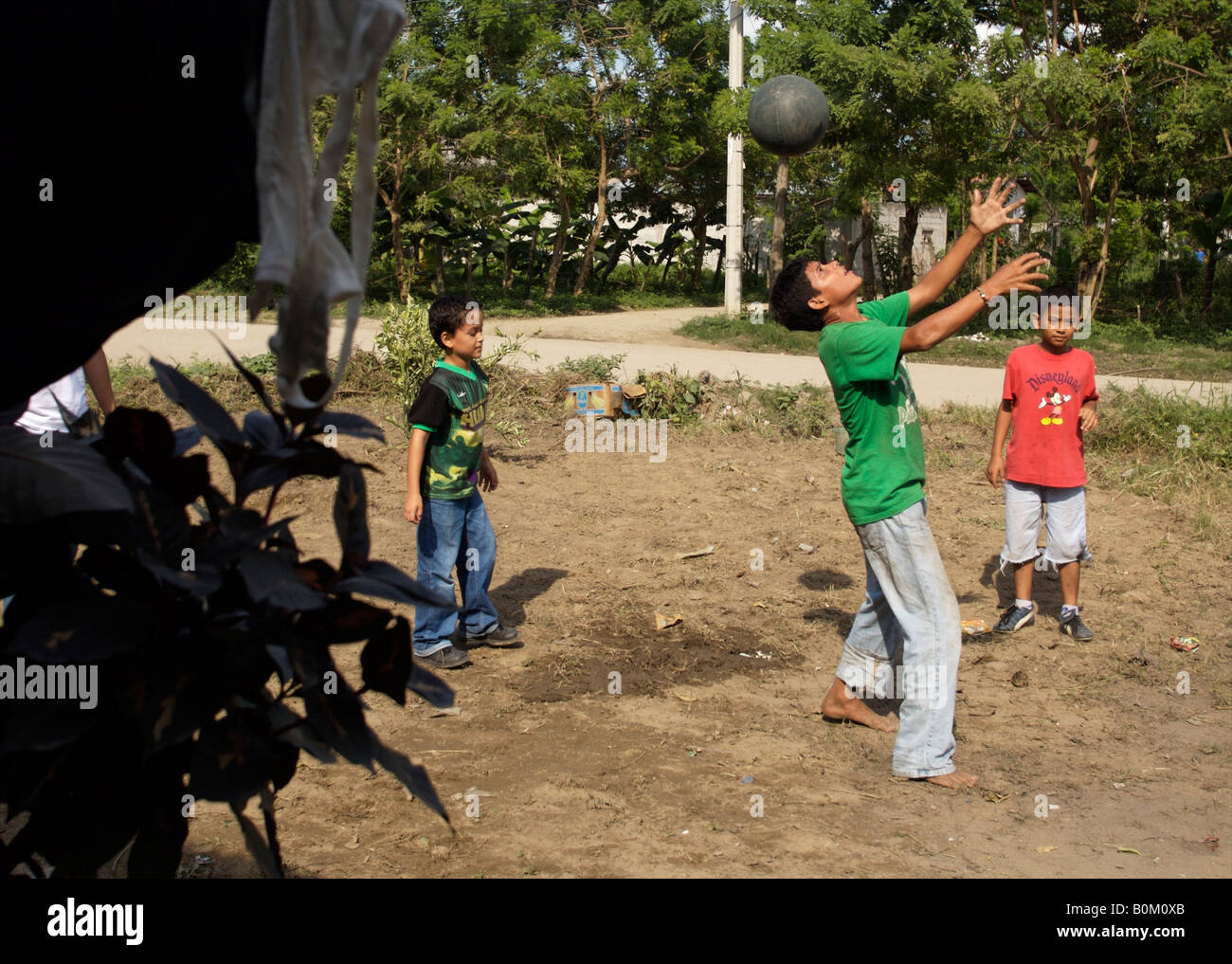 Children and teens play soccer football in a neighborhood of San Pedro Sula Honduras on Wednesday November 8 2006 Stock Photo