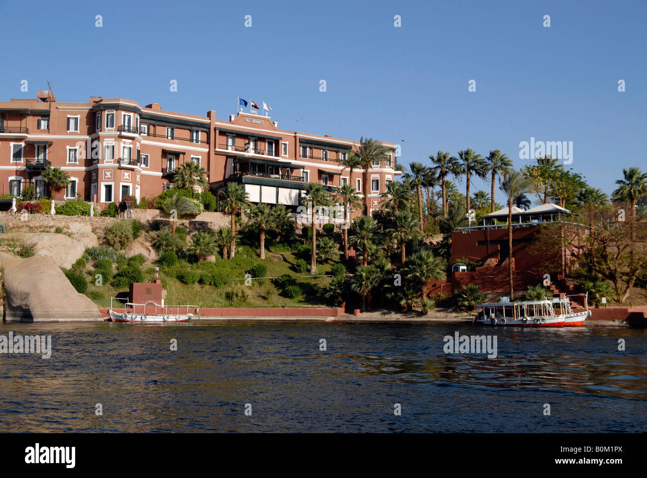 View from the River Nile of the Old Cataract Hotel made famous by Agatha Christie Aswan Egypt Stock Photo