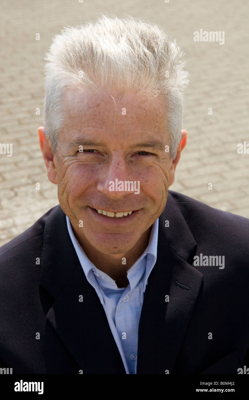 Smiling Business Man Outdoors With Silver Grey Hair Stock Photo