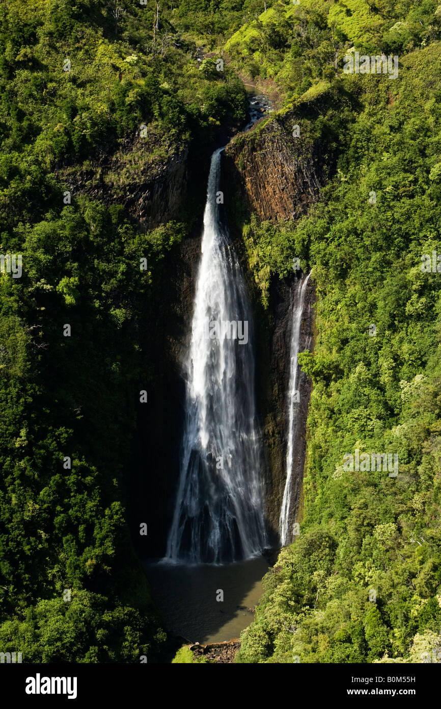 Scenic wide aerial portrait of famous Jurassic Park waterfalls surrounded by green lush trees