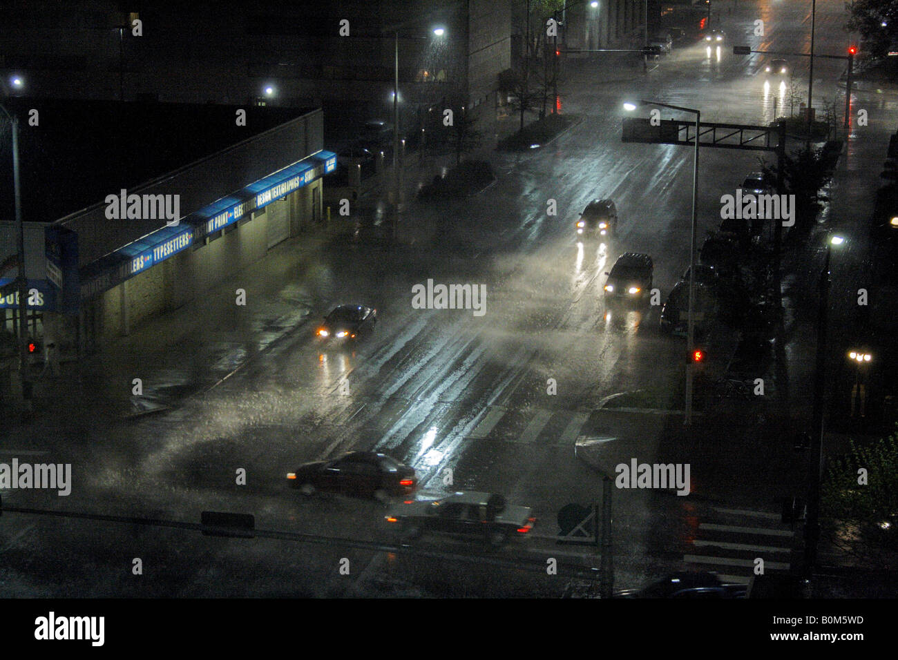 Cars driving in rain Stock Photo Alamy