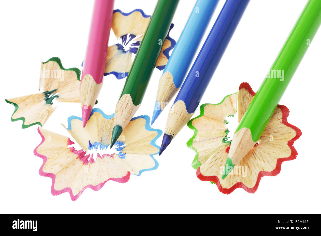 Top view of colored pencils with shavings and pencil sharpener over white  background. top view Stock Photo - Alamy