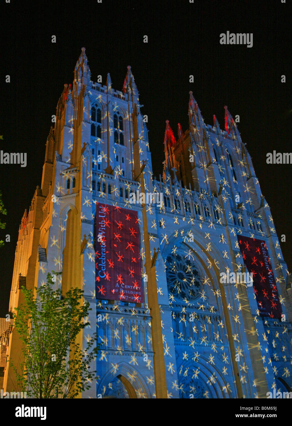 Public art event - illuminating American National Cathedral in Washington DC at night with a transparency of blue sky & stars. Stock Photo