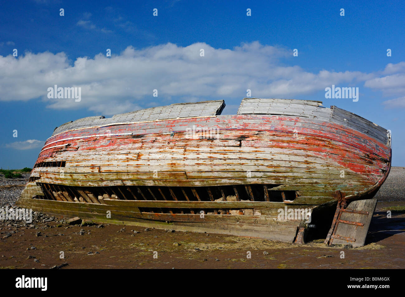 Beached wreck of a wooden boat . Rampside , Morecambe Bay , Cumbria , England , U . K . , Europe . Stock Photo