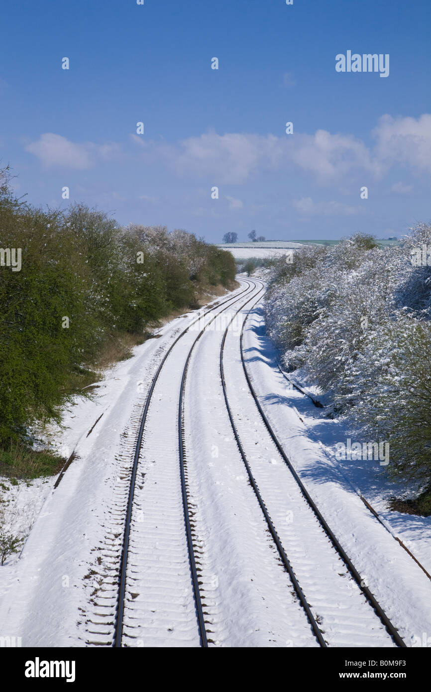 Rail track in the snow between Tackley and Lower Heyford Oxfordshire England Stock Photo