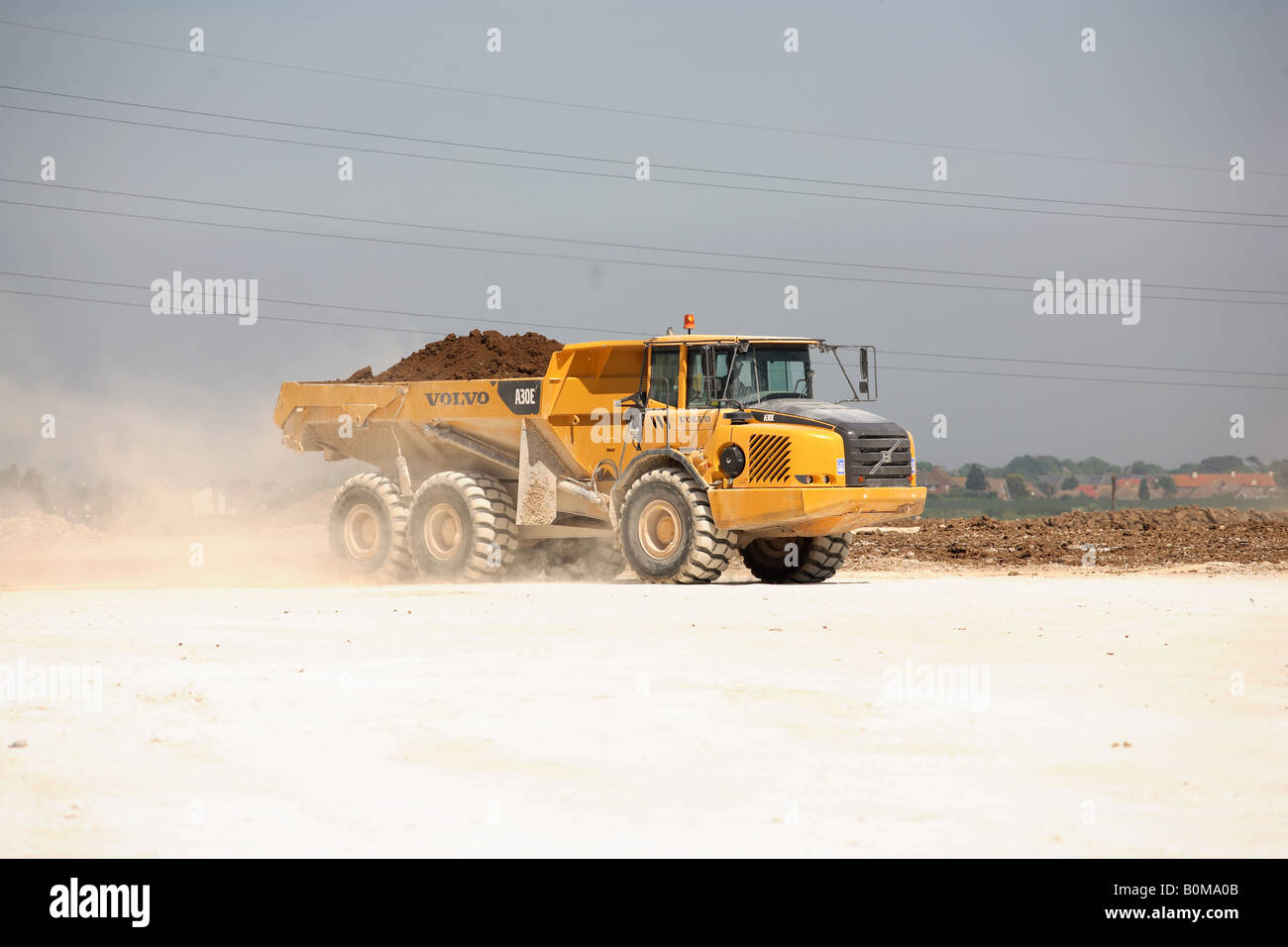 A large earth moving truck on a building site Stock Photo Alamy