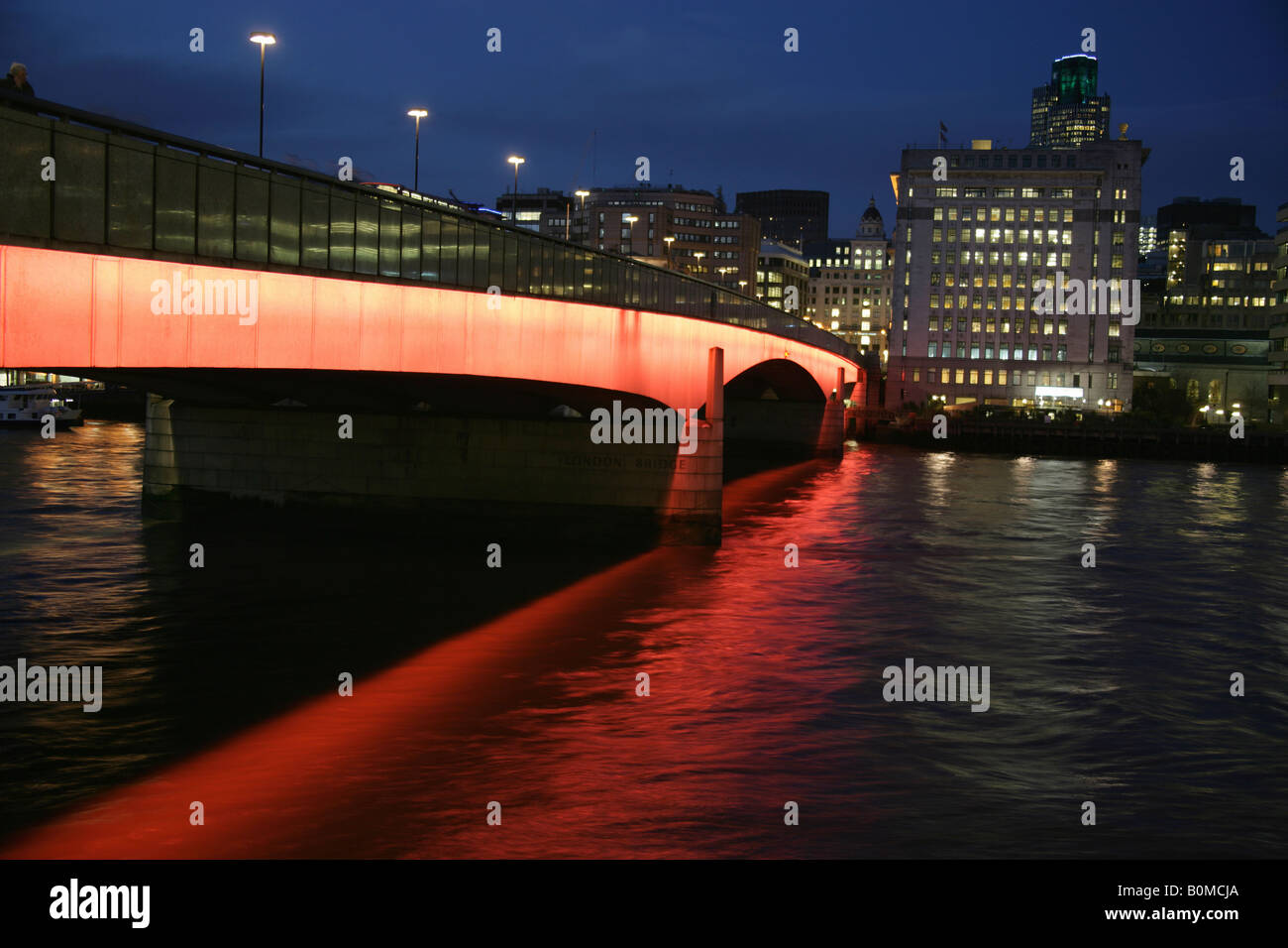 City of London, England. Night view of London Bridge over the River Thames with the City of London in the background. Stock Photo