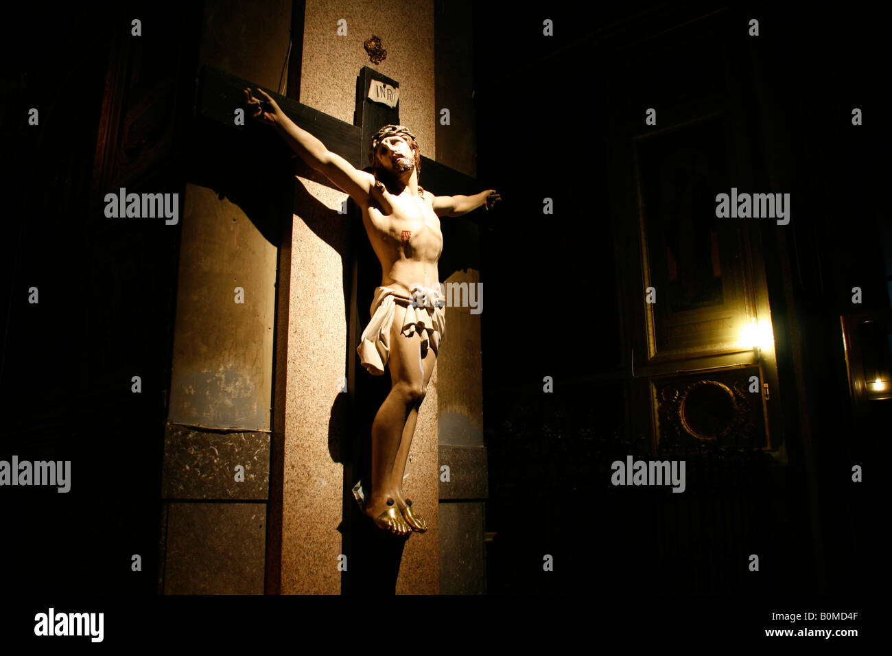jesus on cross statue in church in rome italy Stock Photo - Alamy