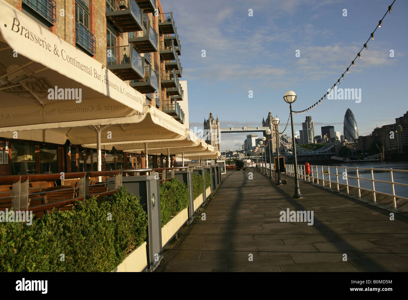 City of London, England. Residential apartments and restaurants at Butlers Wharf on the South Bank of the River Thames. Stock Photo