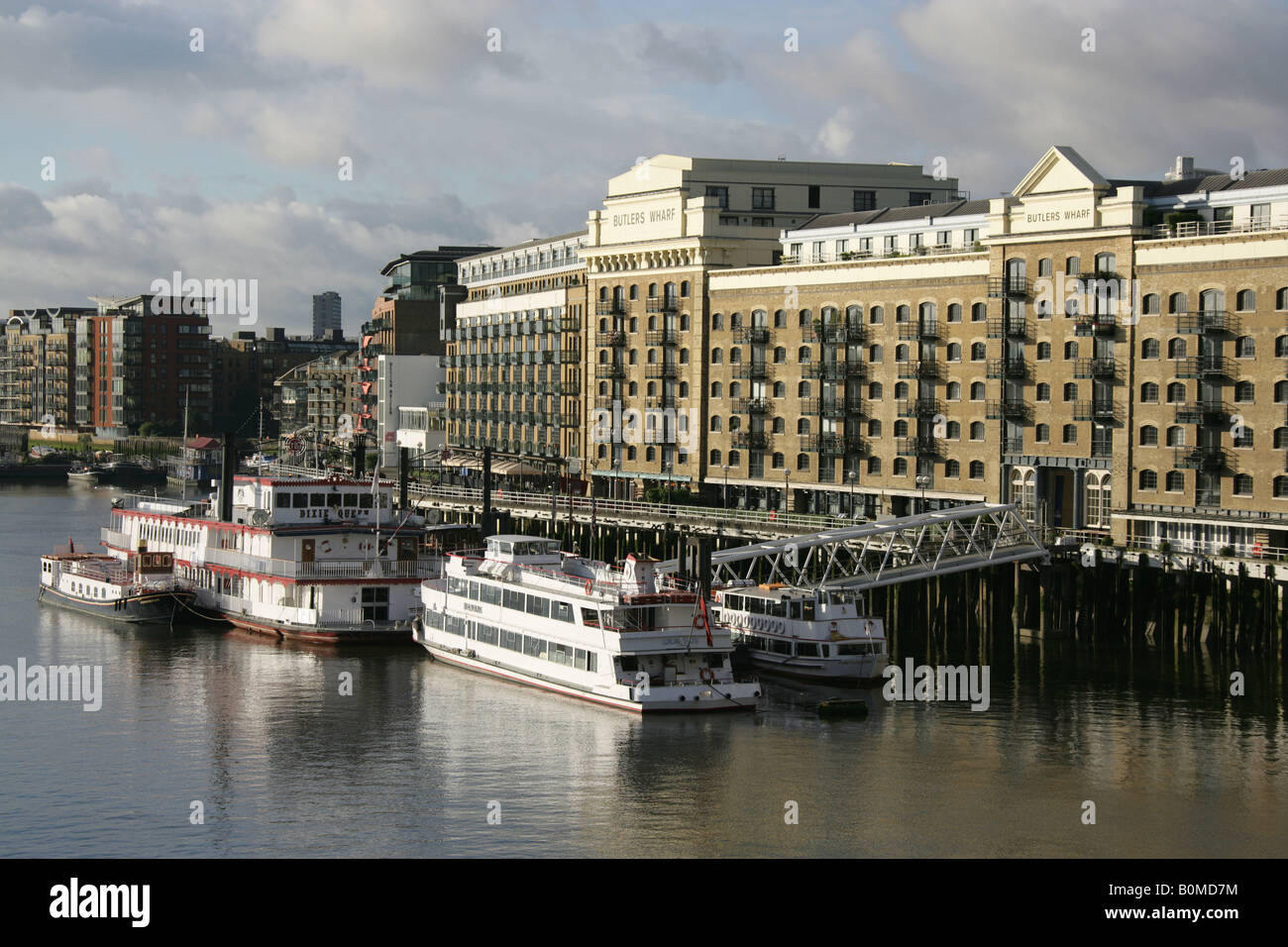 City of London, England. Morning view of Thames river cruise entertainment ships moored at Butlers Wharf on the River Thames. Stock Photo