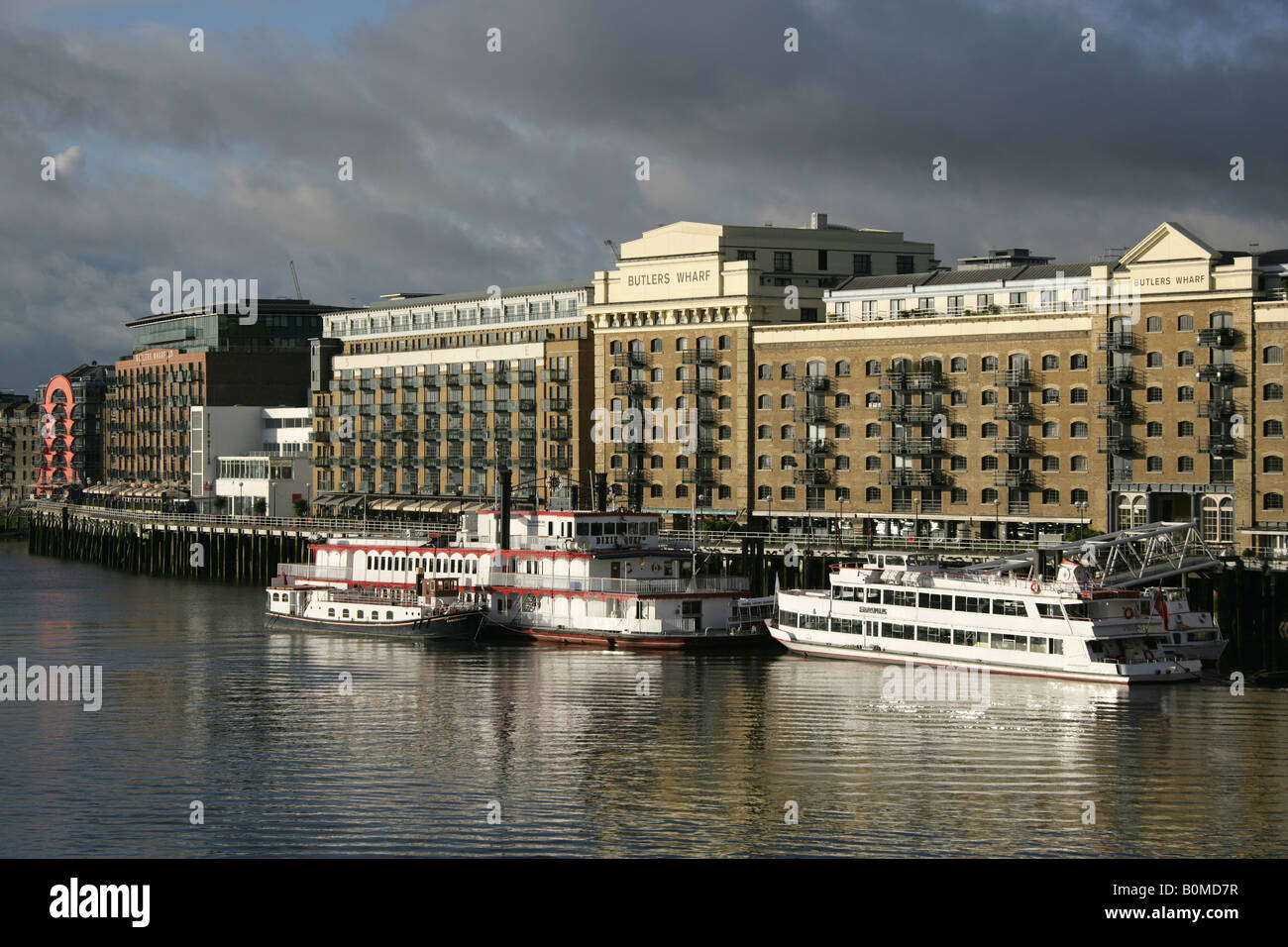 City of London, England. Morning view of Thames river cruise entertainment ships moored at Butlers Wharf on the River Thames. Stock Photo