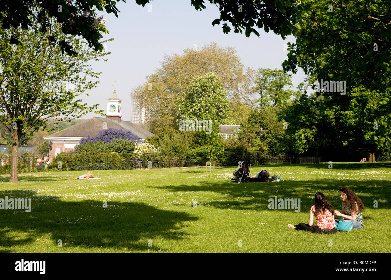 People Sitting In Hyde Park London UK Stock Photo