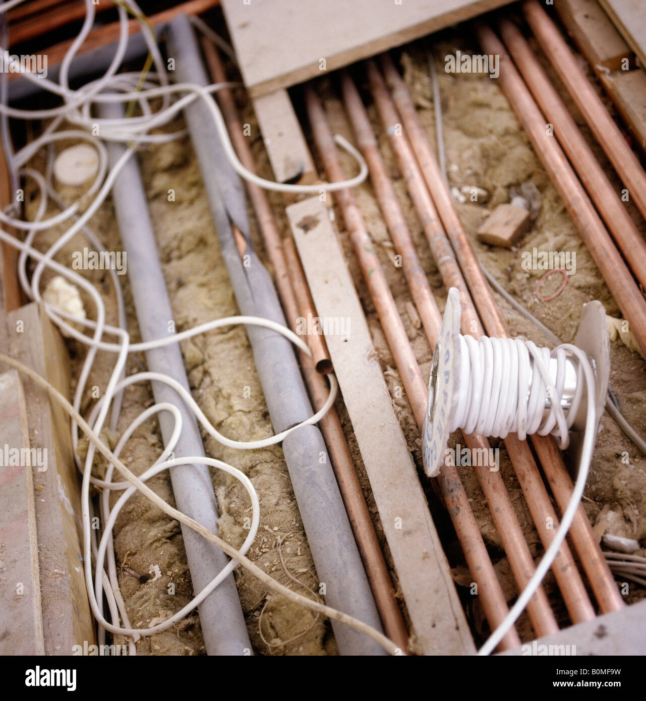 building works and pipes under floorboards in a house Stock Photo Alamy