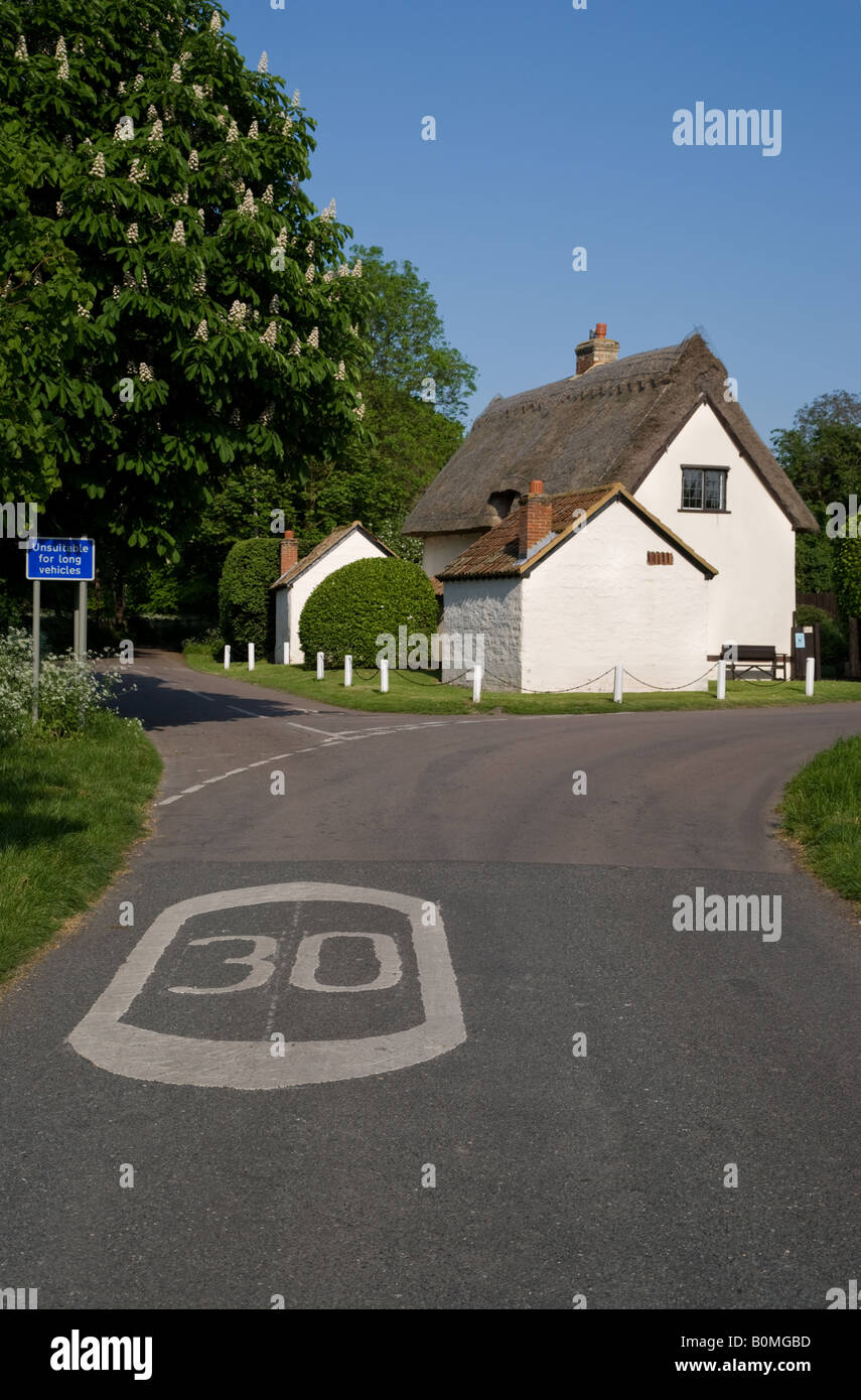 A road sign in and thatched house in Ashwell, an English town in Hertfordshire, UK Stock Photo