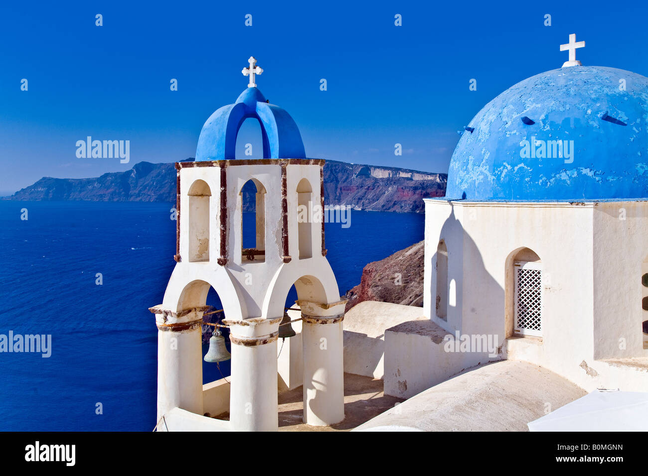 Blue dome rooftops of churches looking over the ocean Oia Santorini Greece Stock Photo
