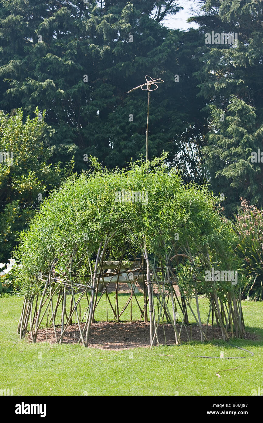 Dome made of living willow in garden in Spring in UK Stock Photo