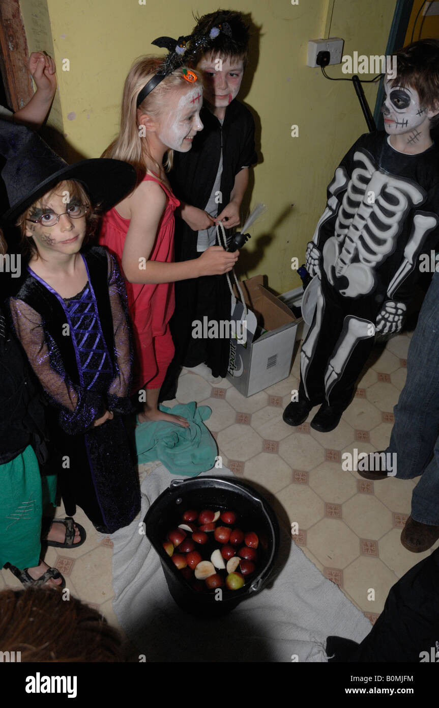 Young children bobbing for apples Halloween party Marloes Haverfordwest Wales UK Europe Stock Photo