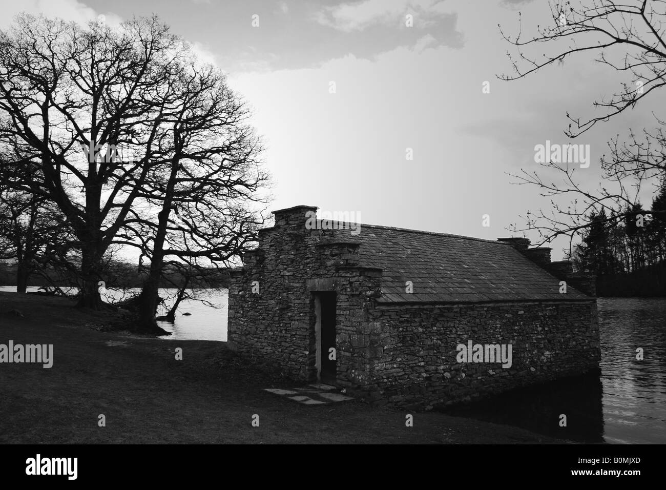 A dry stone boathhouse on the shore of Lake Windermere Stock Photo