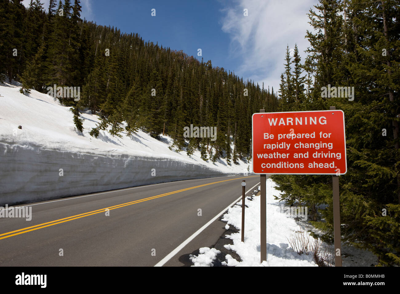 Warning sign that reads Be prepared for rapidly changing weather and driving conditions ahead Trail Ridge Road RMNP Colorado USA Stock Photo