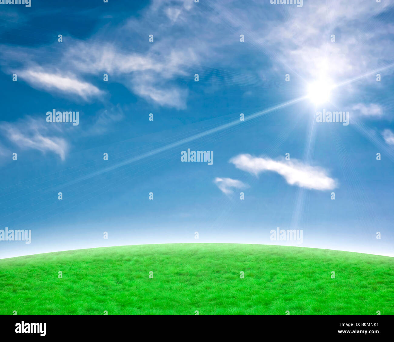 Blue sky and gree slope with a beautiful sun flare background Stock Photo