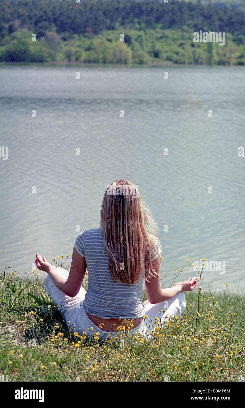 young woman yoga meditation outdoor Stock Photo