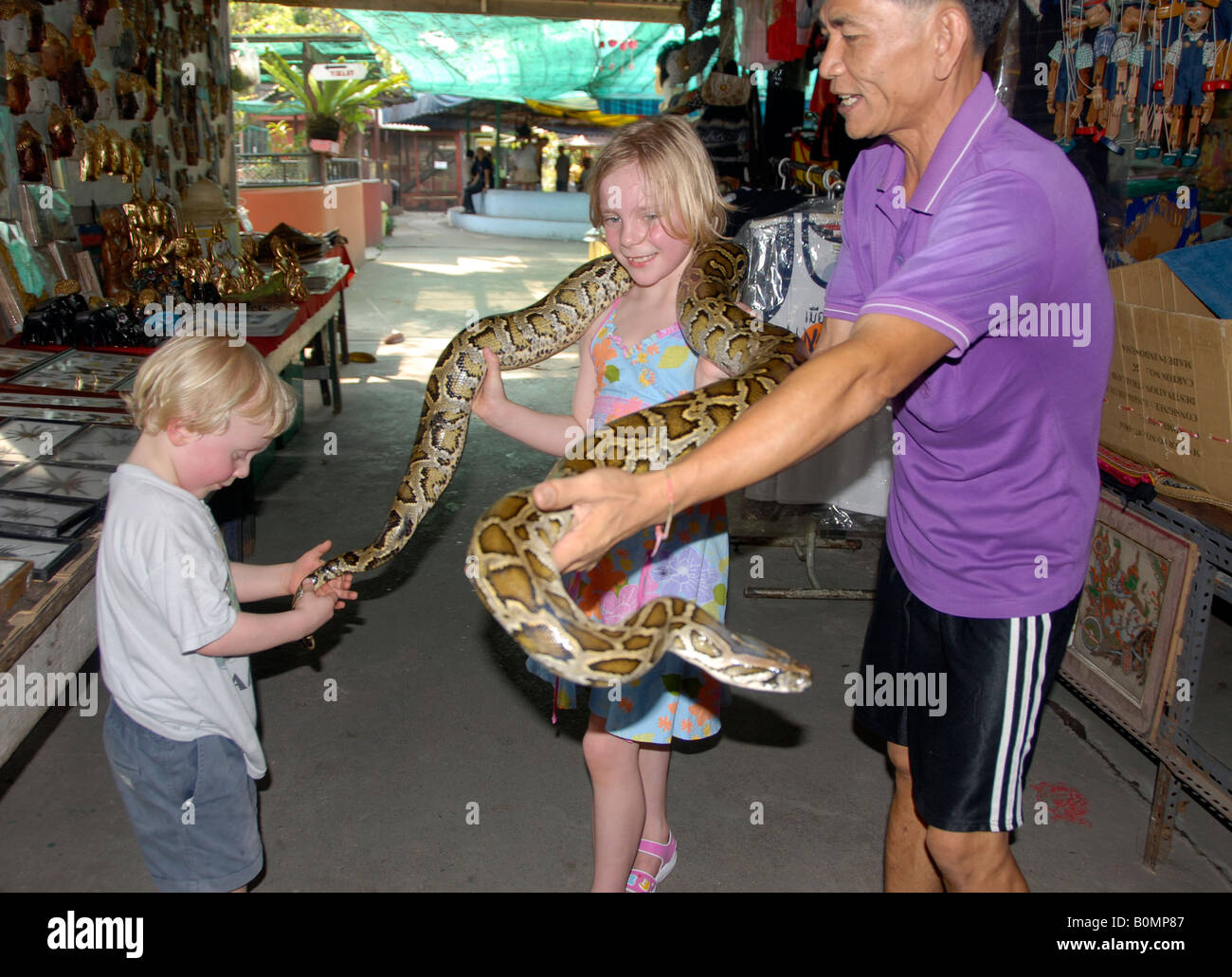 Wilf and Lucy are shown a live python, snake farm and small zoo ...