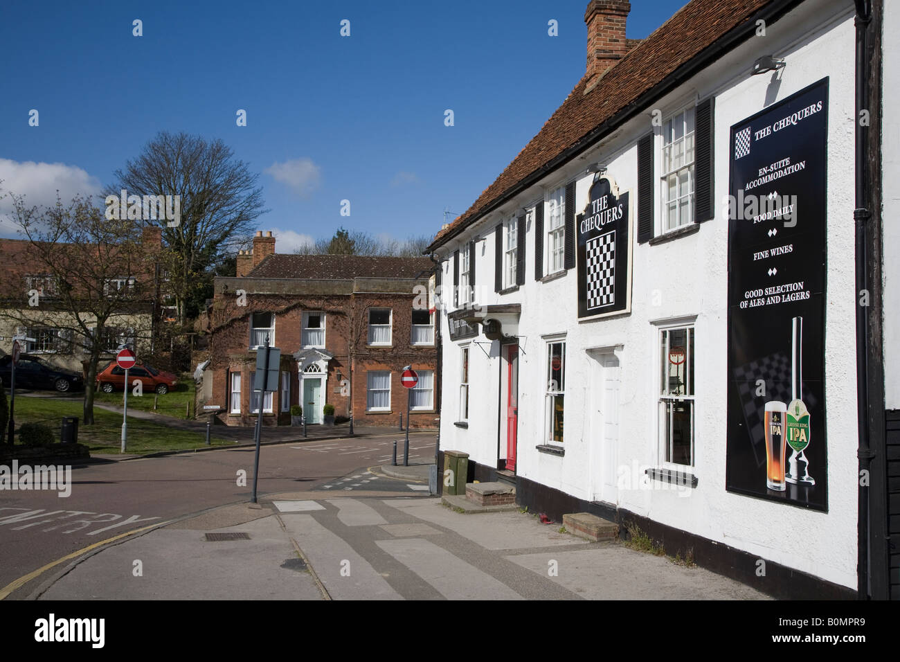 The Chequers public house traditional pub in old building on corner of road Royston England UK Stock Photo