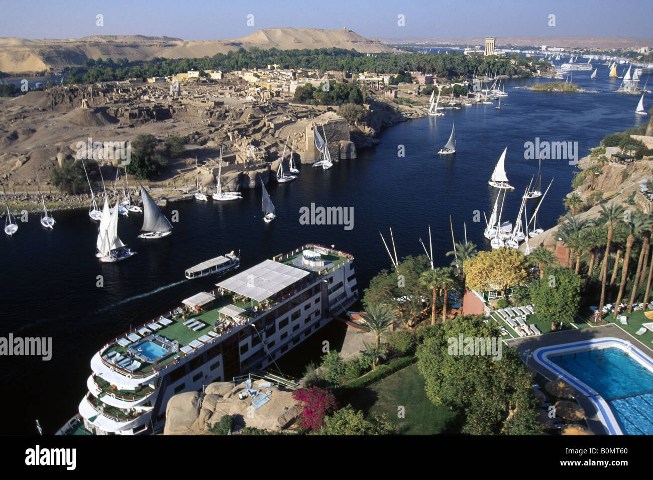Cruiser in front of the Old Cataract Hotel at Nile River in Asswan Egypt Stock Photo