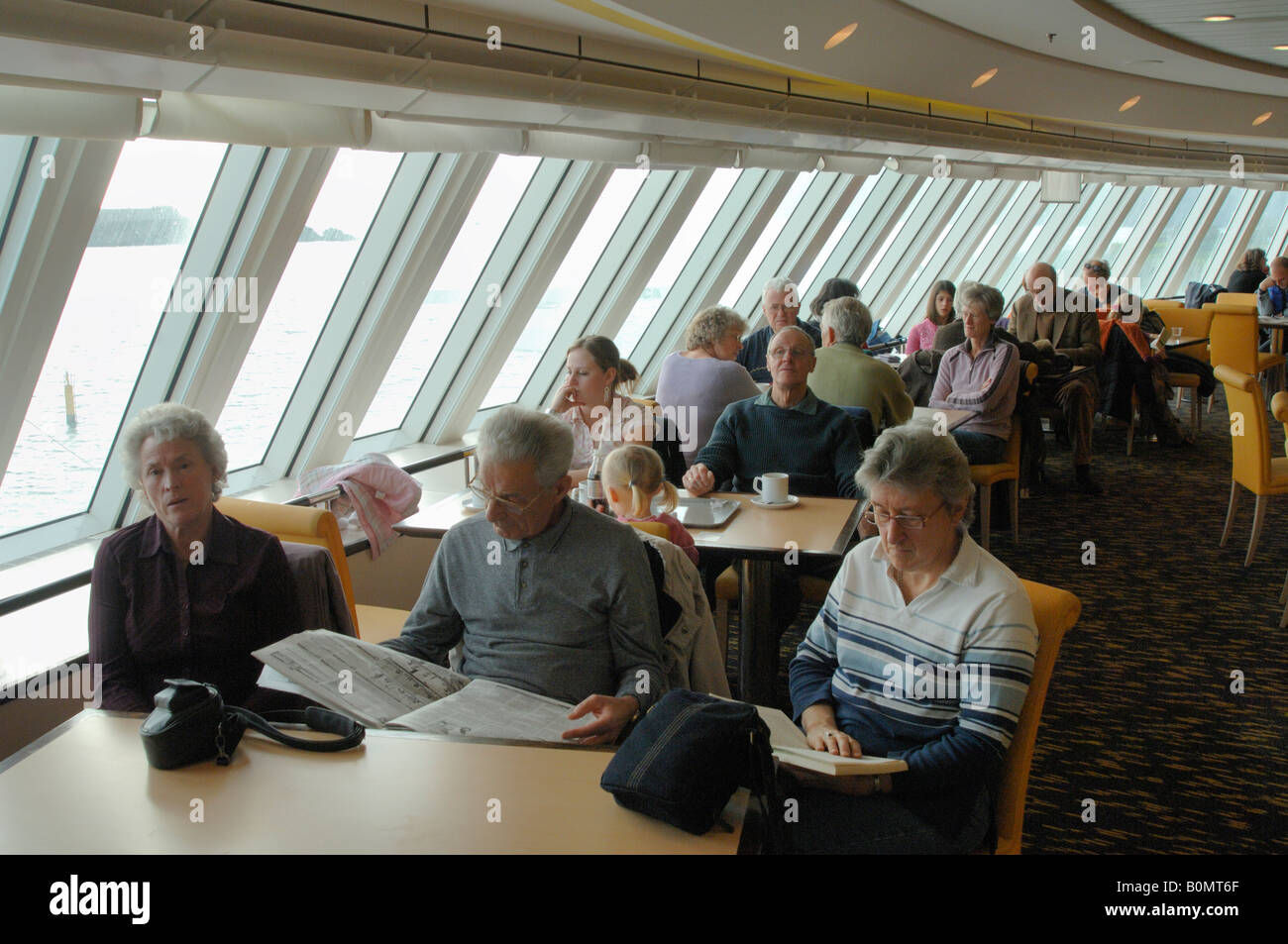 People sitting in restaurant Pont Aven ferry Brittany Ferries Plymouth to Roscoff crossing Atlantic Ocean Stock Photo