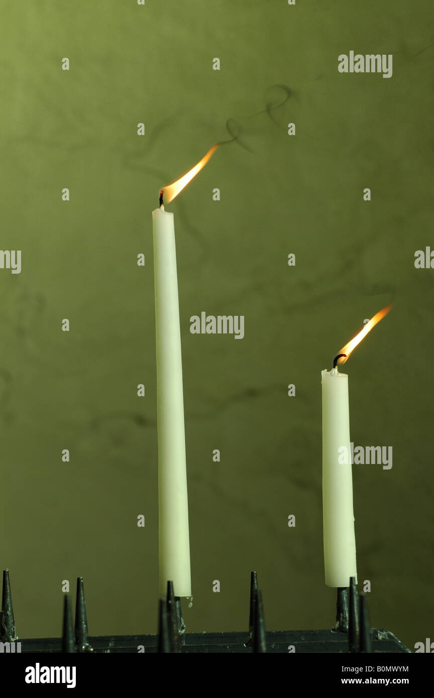 pair of lighted candles in church Stock Photo Alamy