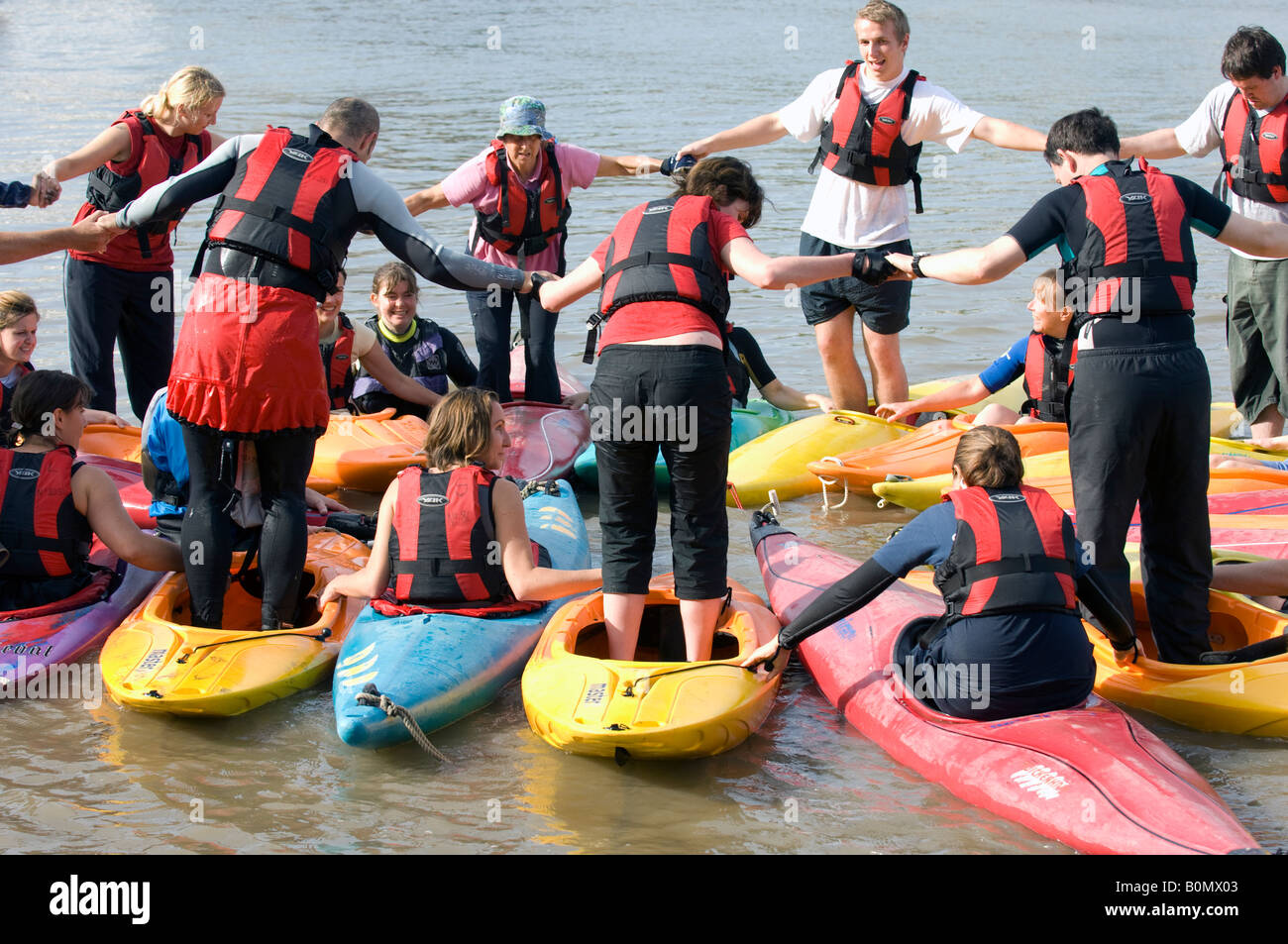 Learning canoe skills on during the THames festival in London Stock