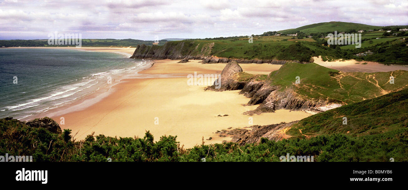 This is a colour panorama of three cliffs bay on the Gower Peninsula in Swansea. It is taken looking towards oxwich and tor Stock Photo