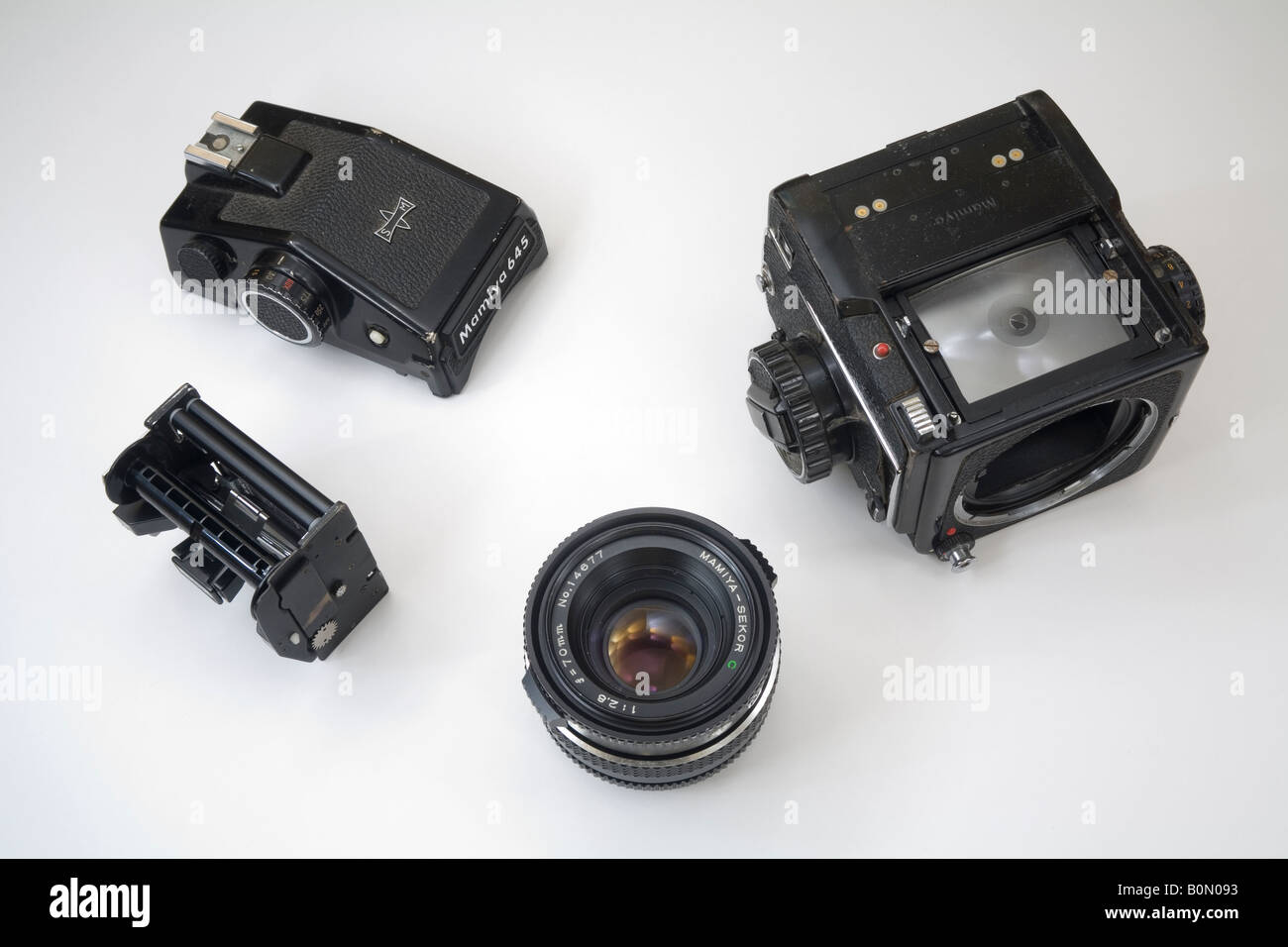 classic Mamiya 645 medium format camera broken down into its individual parts Stock Photo